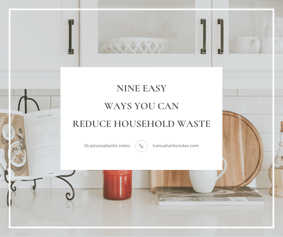 An open cookbook on a stand, orange kitchen utensils, and three wooden cutting boards on a clean, white kitchen counter.