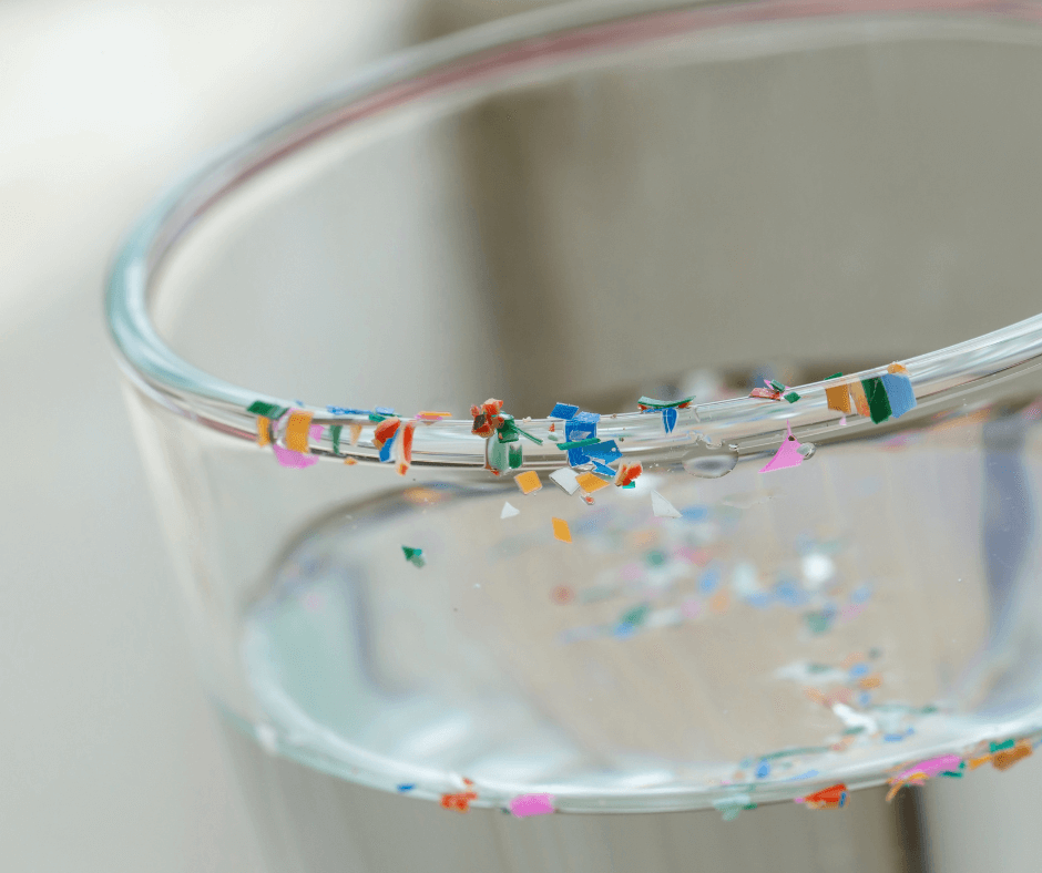 Microplastics collected around the rim of a glass of water.